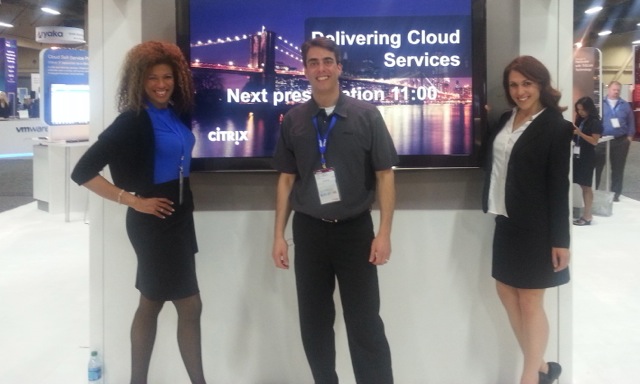 Trade show presenter Andy Saks with booth assistants Kecia and Stasha